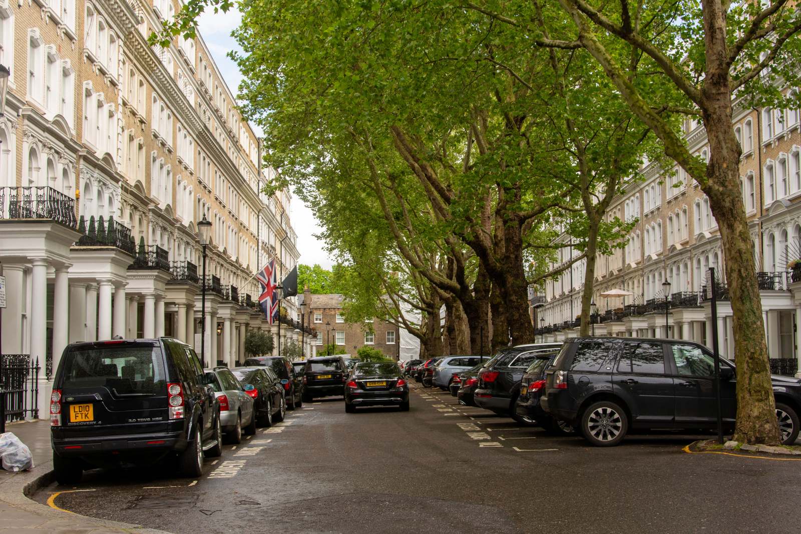 A tree-lined Belgravia terrace of white stucco houses