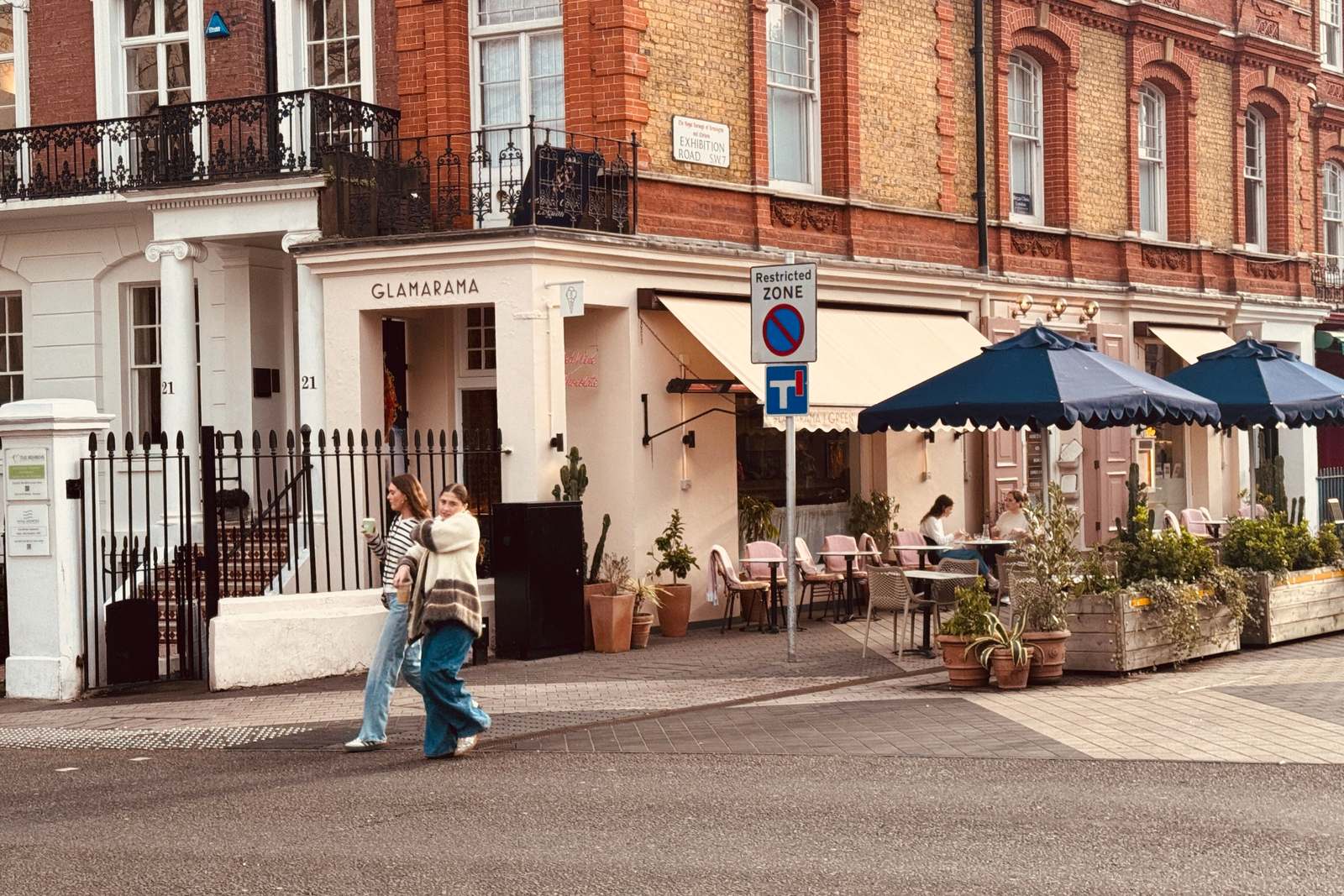 A corner cafe with pavement tables on a Chelsea side street